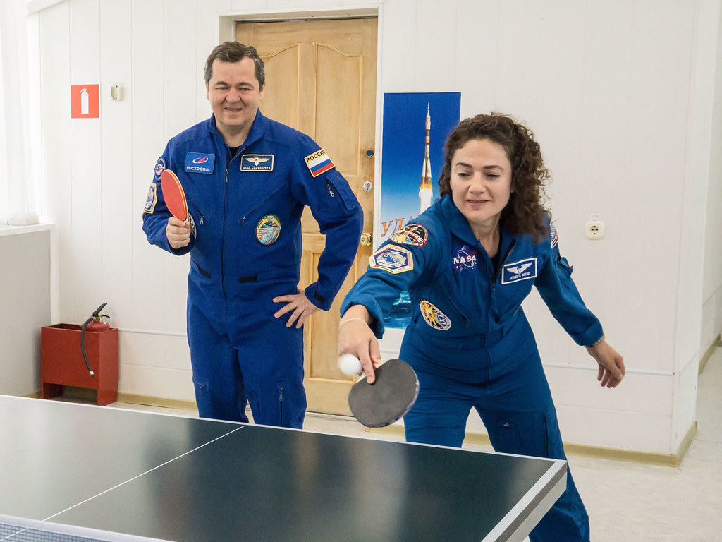 Expedition 61 crewmembers share a game of ping-pong